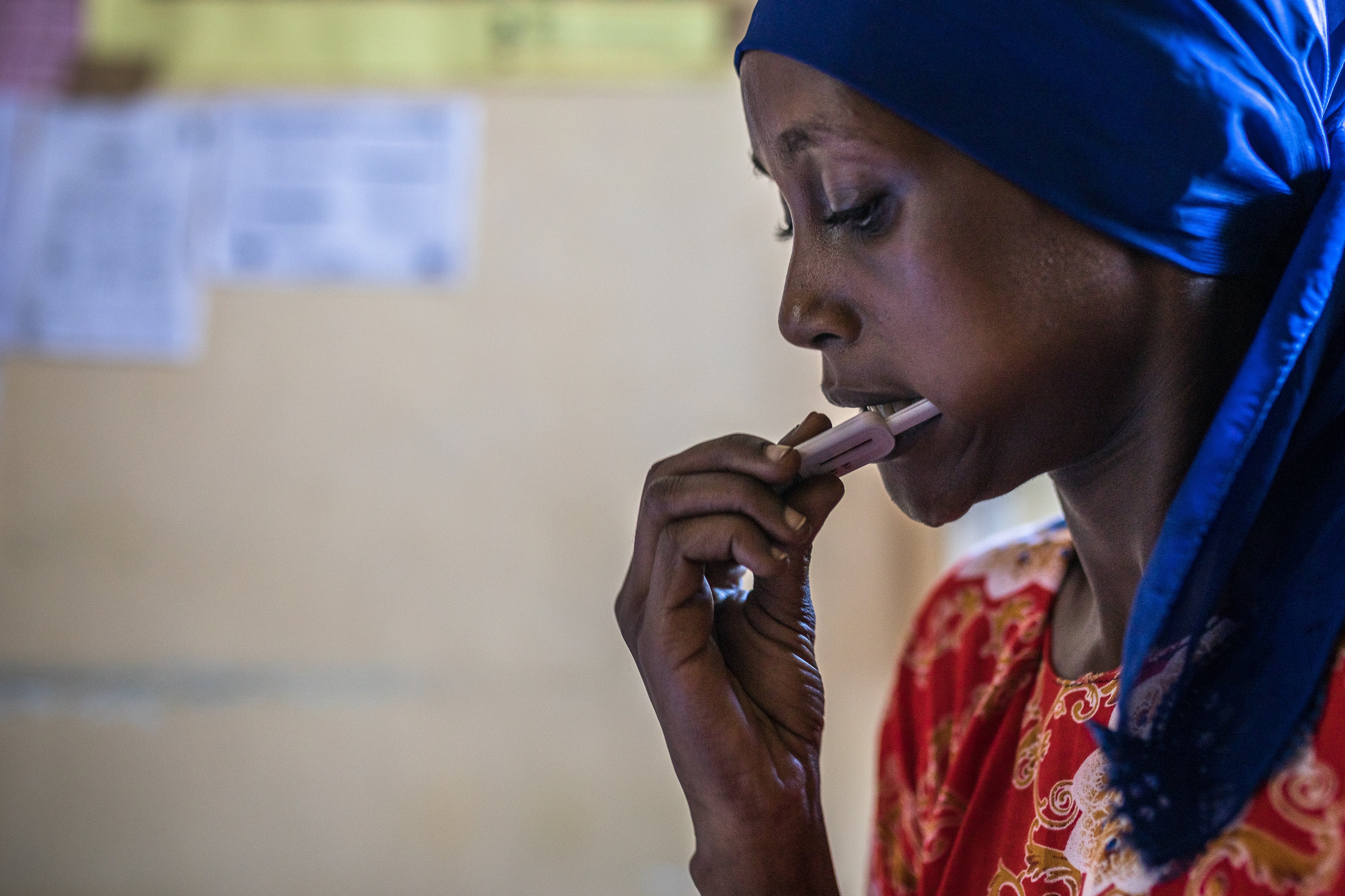 Woman performing a hepatitis C self-test