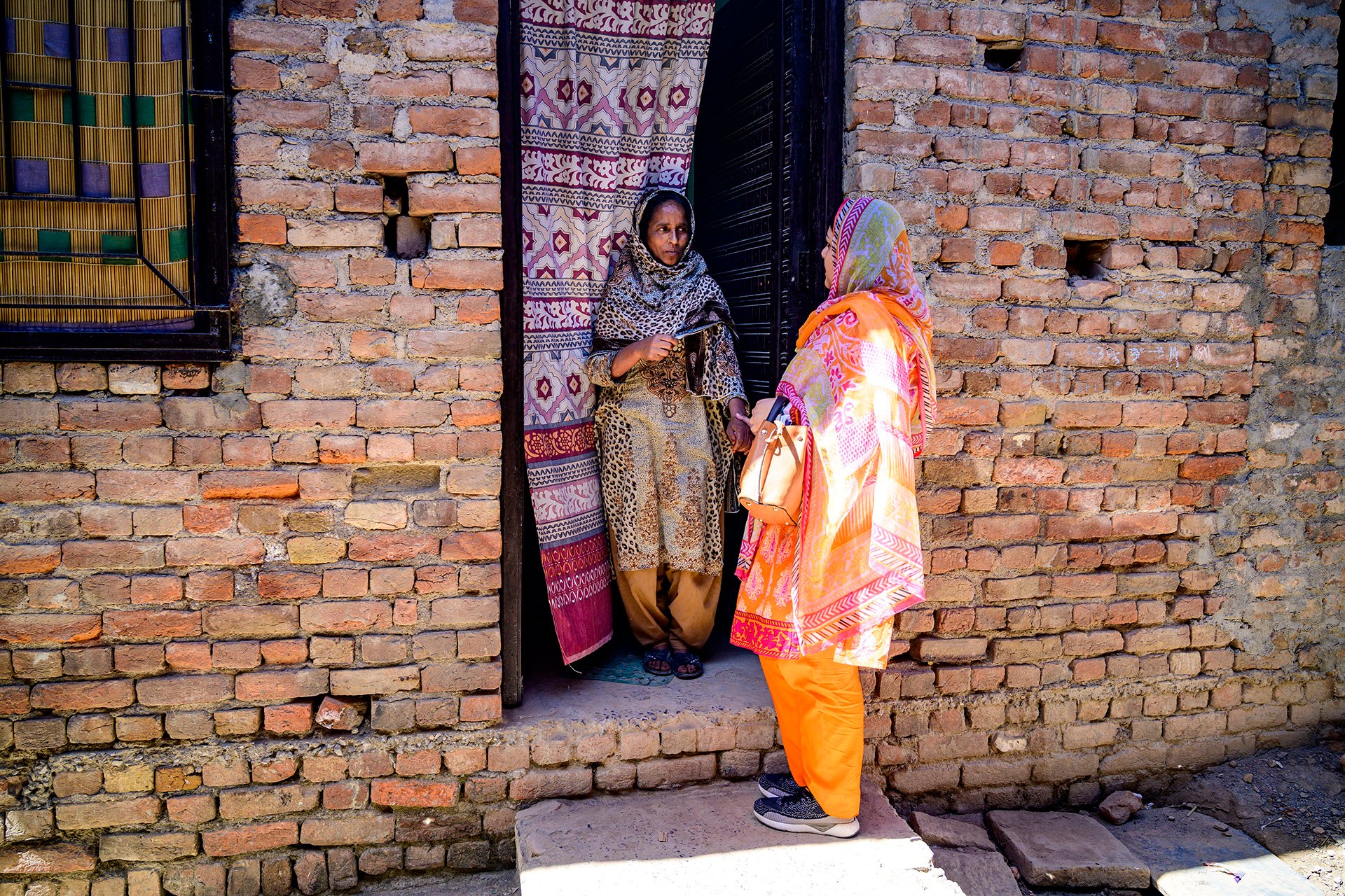 Two women standing in a doorway
