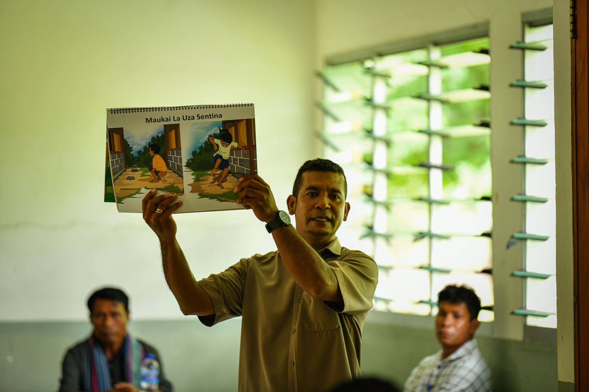 Teacher explaining deworming story
